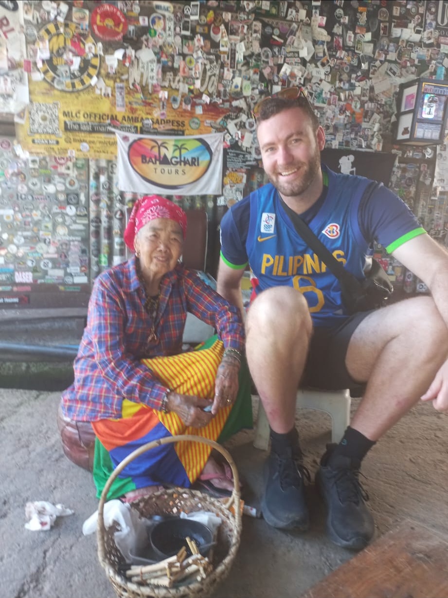 Brandon meeting a local woman in the Philippines